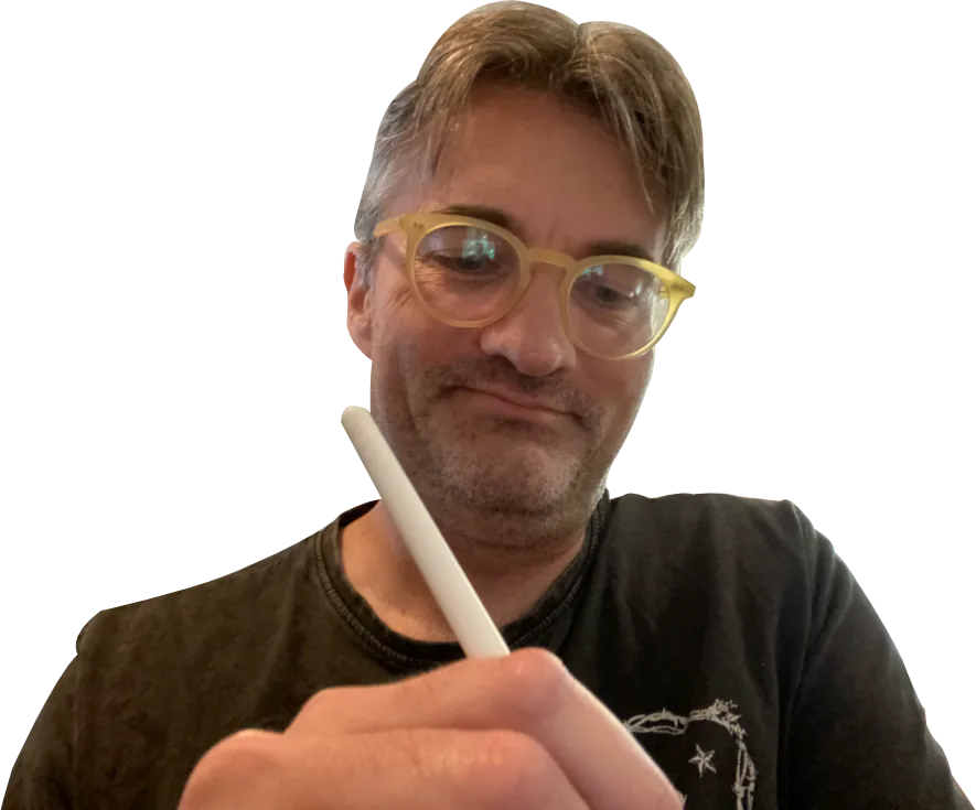 Lee Sheppard, holding a stylus and mid-thought